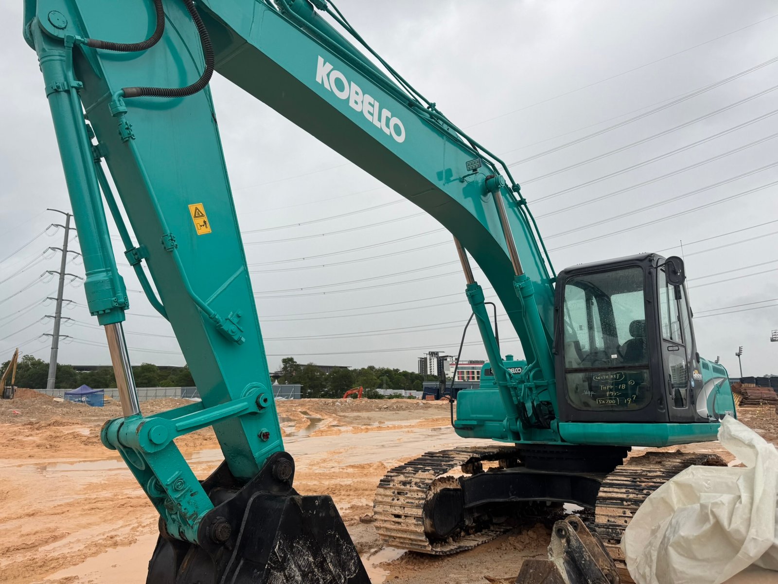 Kobelco SK200 excavator rental in Johor Unit D working on construction site