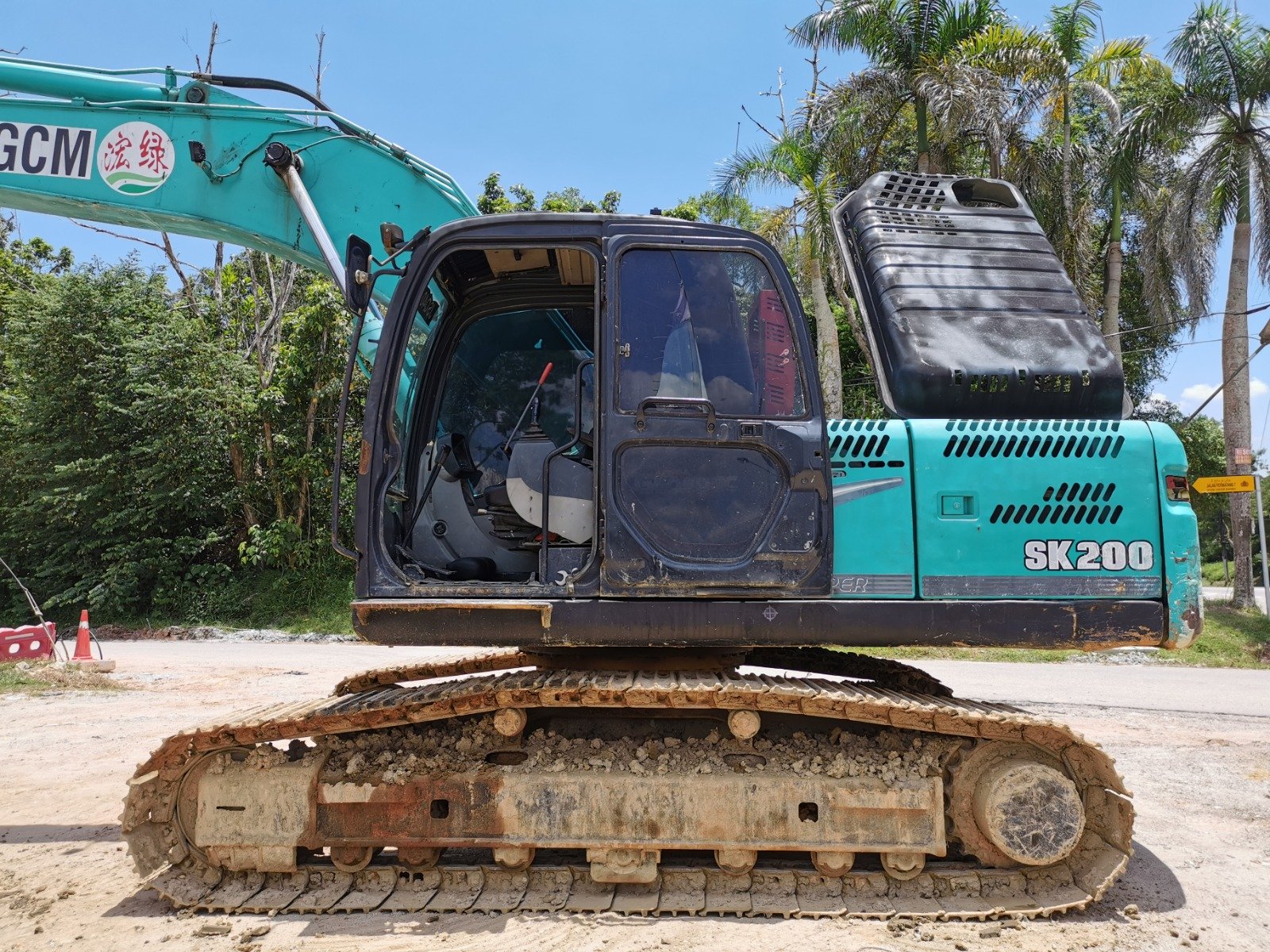 Kobelco SK200 excavator rental in Johor – multiple working views