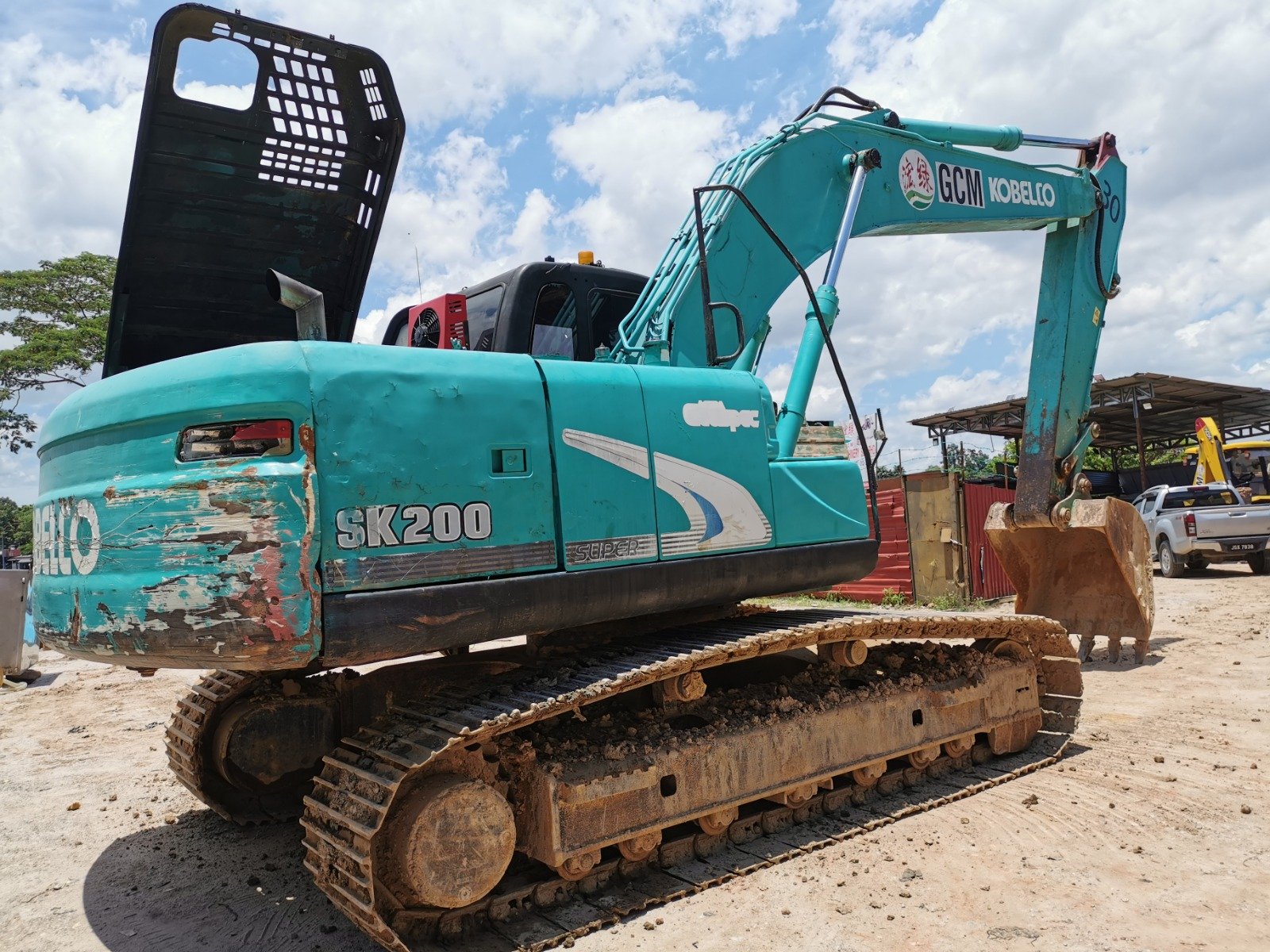 Kobelco SK200 excavator rental in Johor – multiple working views