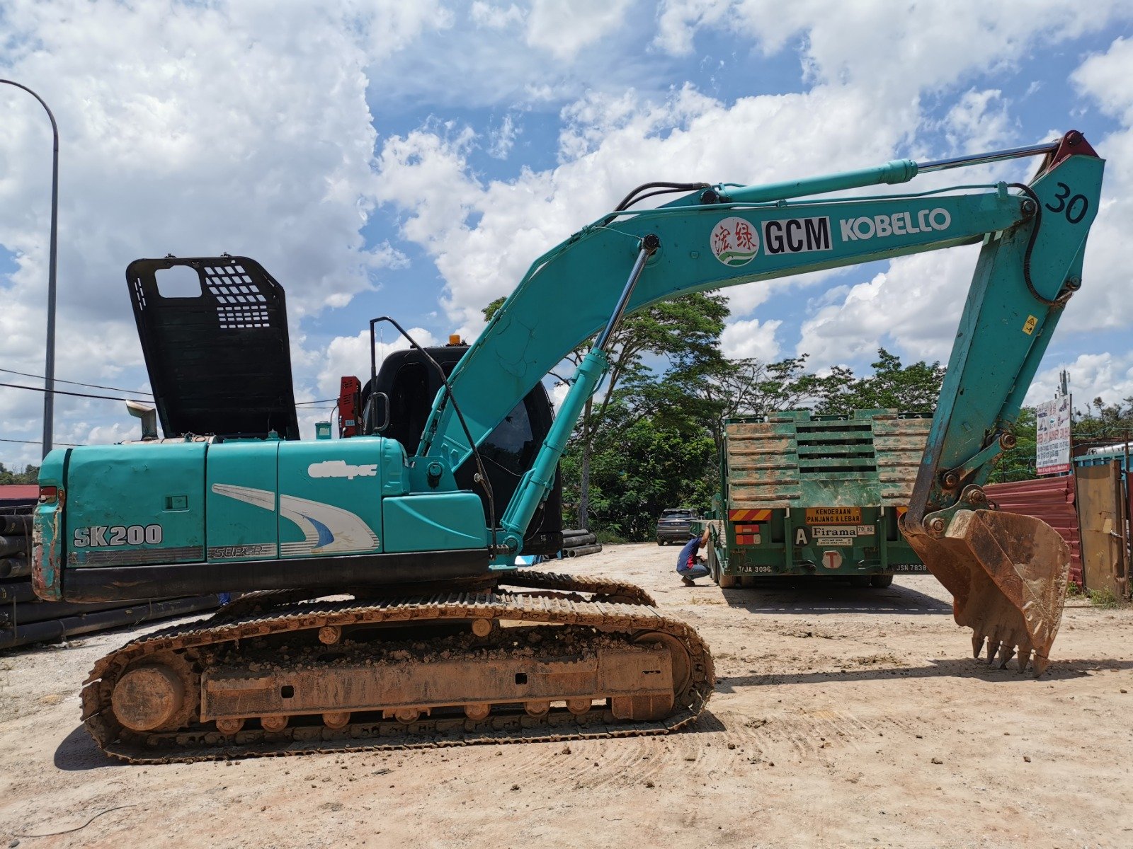 Kobelco SK200 excavator rental in Johor – multiple working views